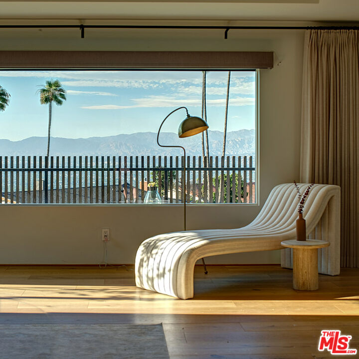 8674 Edwin Drive Los Angeles, CA 90046 - Photo 26 of 53 a bed sitting in a bedroom next to a window