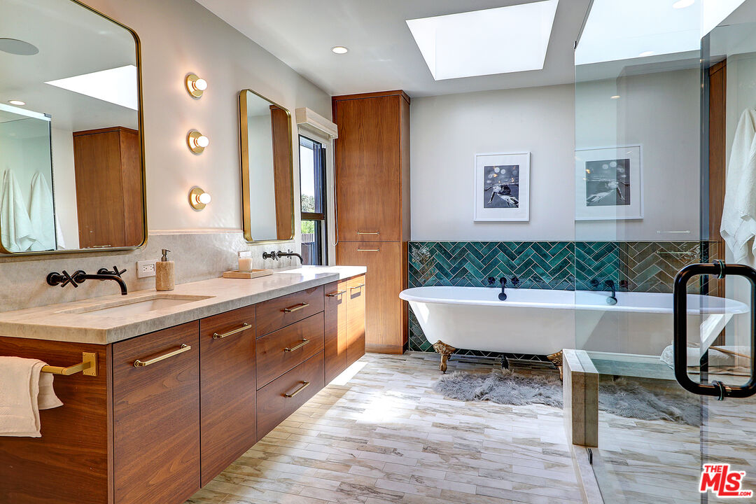 8674 Edwin Drive Los Angeles, CA 90046 - Photo 29 of 53 a bathroom with a bathtub and a sink