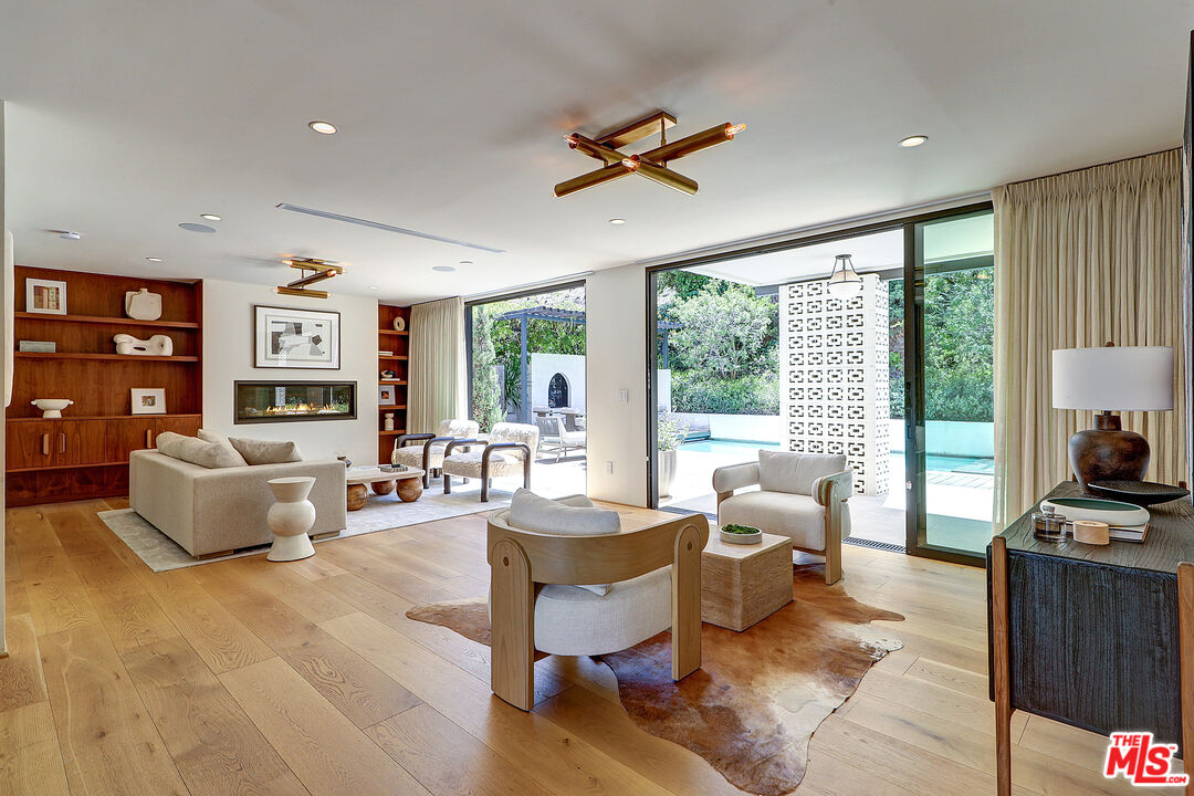 8674 Edwin Drive Los Angeles, CA 90046 - Photo 3 of 53 a living room with fireplace furniture and a flat screen tv