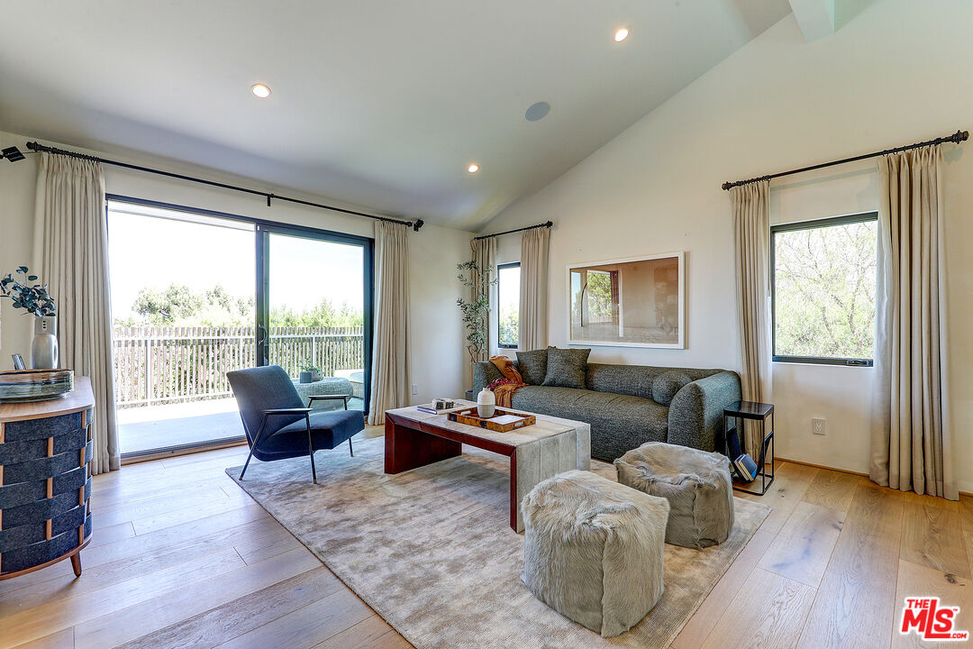 8674 Edwin Drive Los Angeles, CA 90046 - Photo 37 of 53 a living room with furniture and a wooden floor