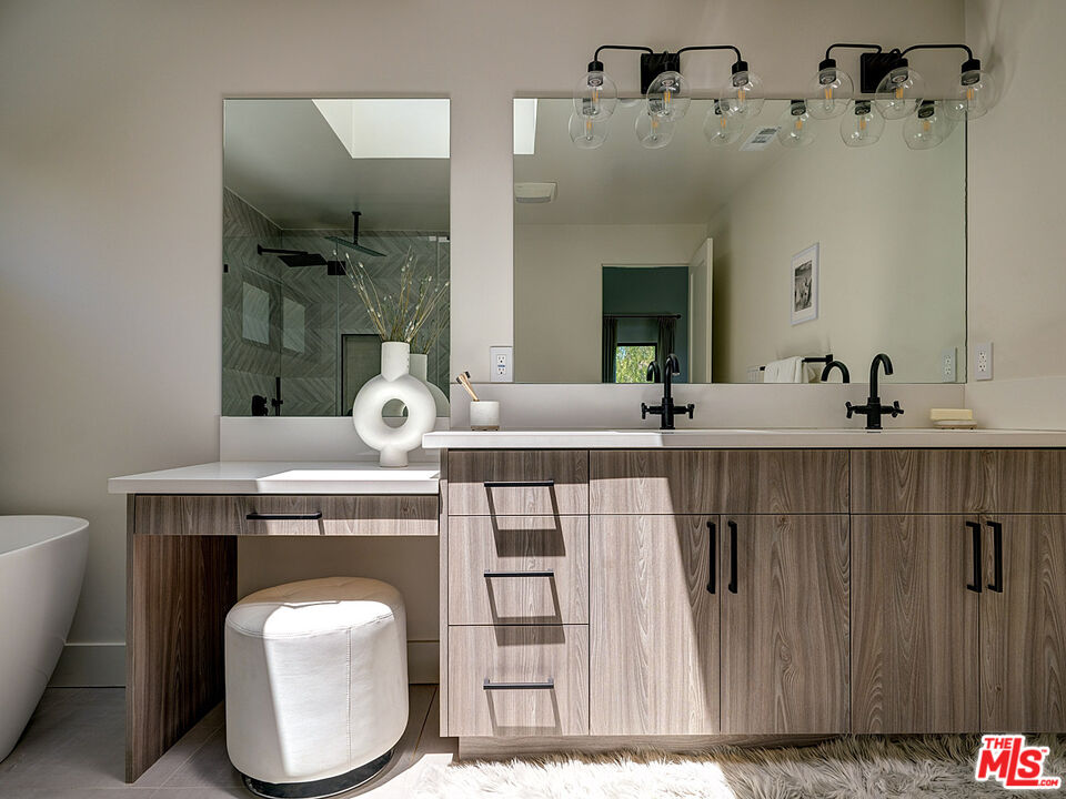 8674 Edwin Drive Los Angeles, CA 90046 - Photo 38 of 53 a bathroom with a sink and a mirror