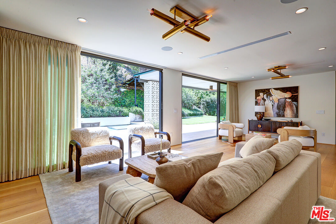 8674 Edwin Drive Los Angeles, CA 90046 - Photo 4 of 53 a living room with furniture and a large window