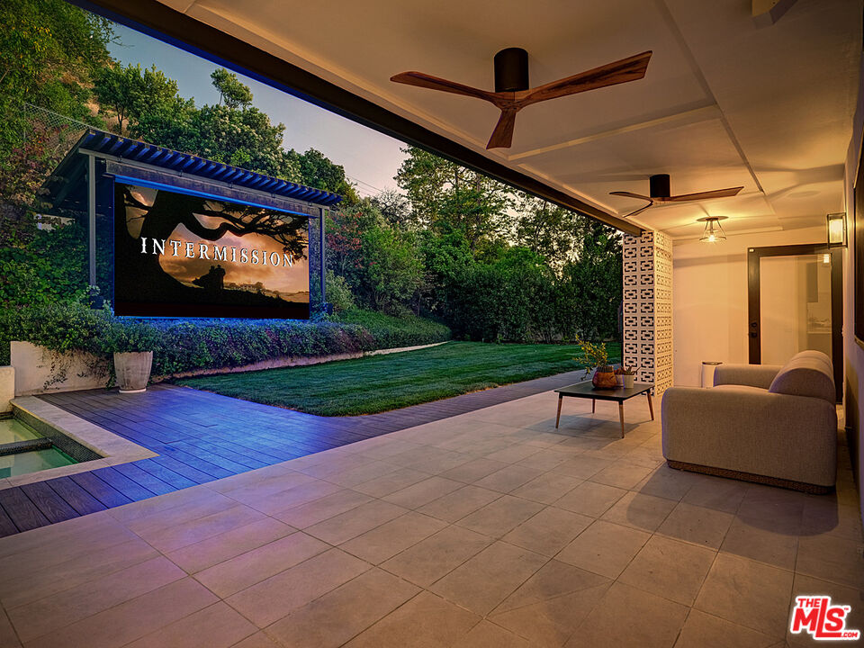 8674 Edwin Drive Los Angeles, CA 90046 - Photo 51 of 53 a living room with patio furniture and a flat screen tv