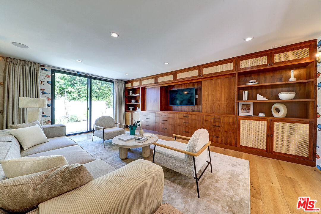 8674 Edwin Drive Los Angeles, CA 90046 - Photo 7 of 53 a living room with furniture and a flat screen tv