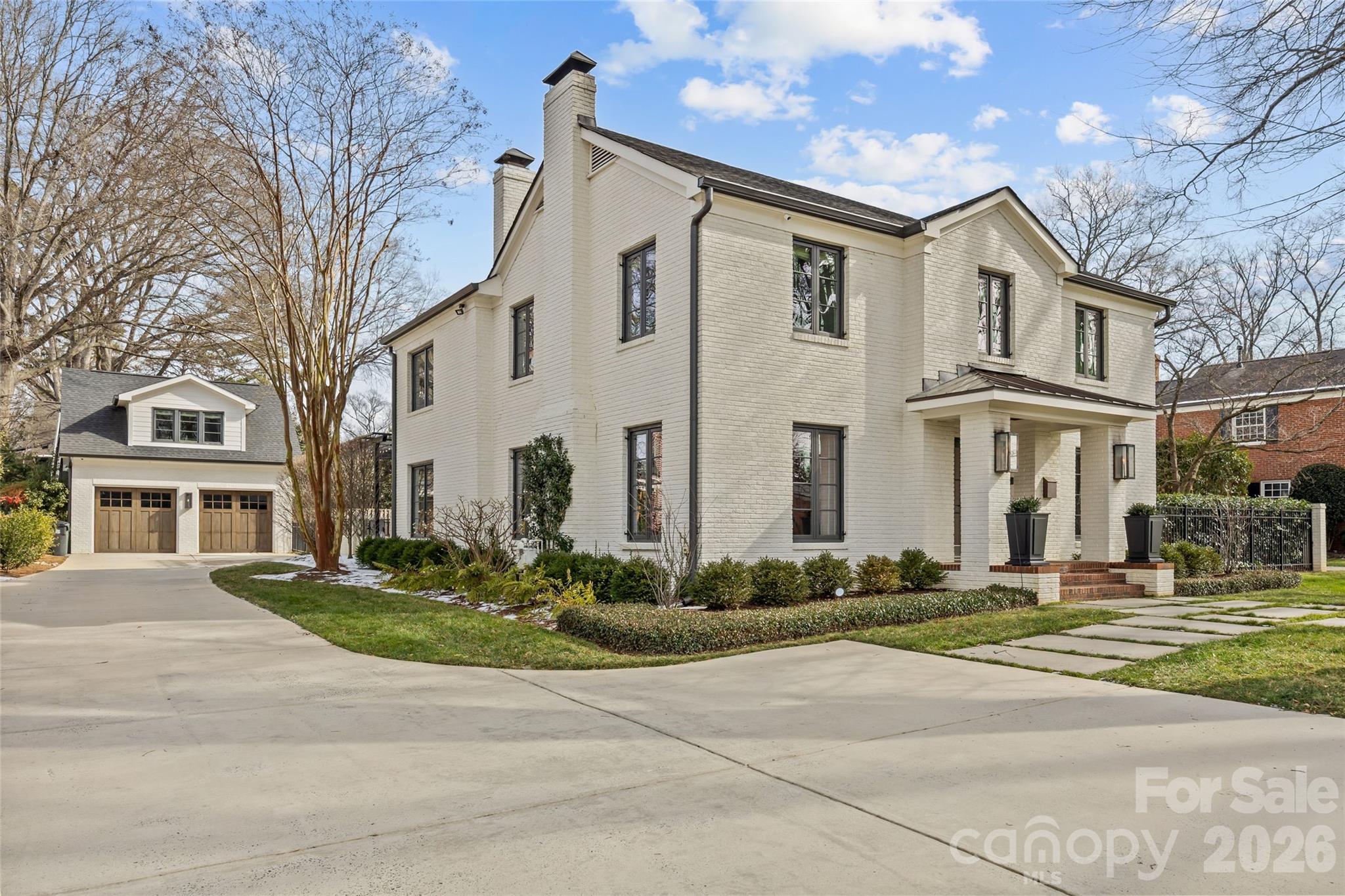 1935 Queens Road West Charlotte, NC 28207 - Photo 1 of 48 a front view of a house with a garden