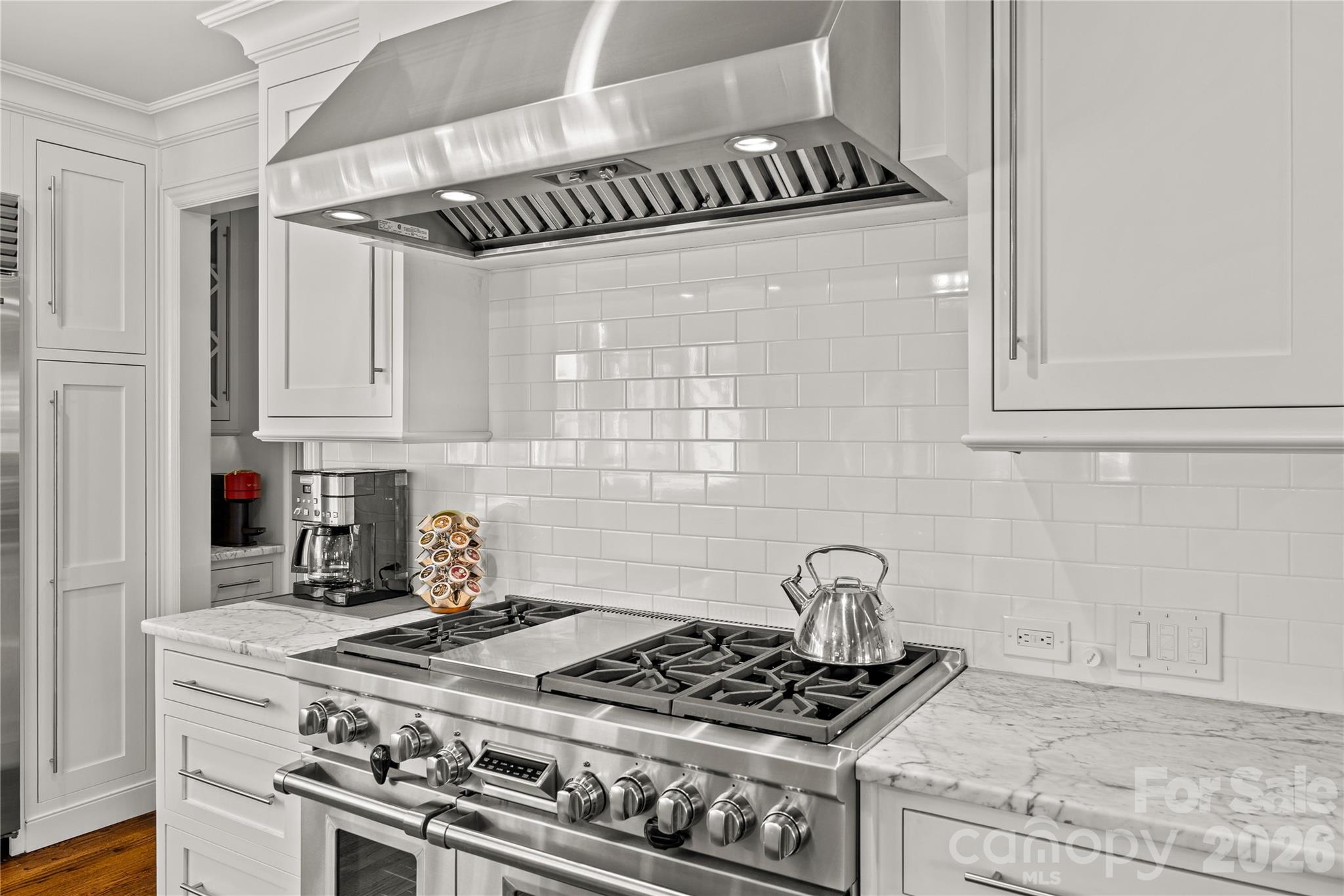 1935 Queens Road West Charlotte, NC 28207 - Photo 16 of 48 a kitchen with granite countertop a stove and a sink