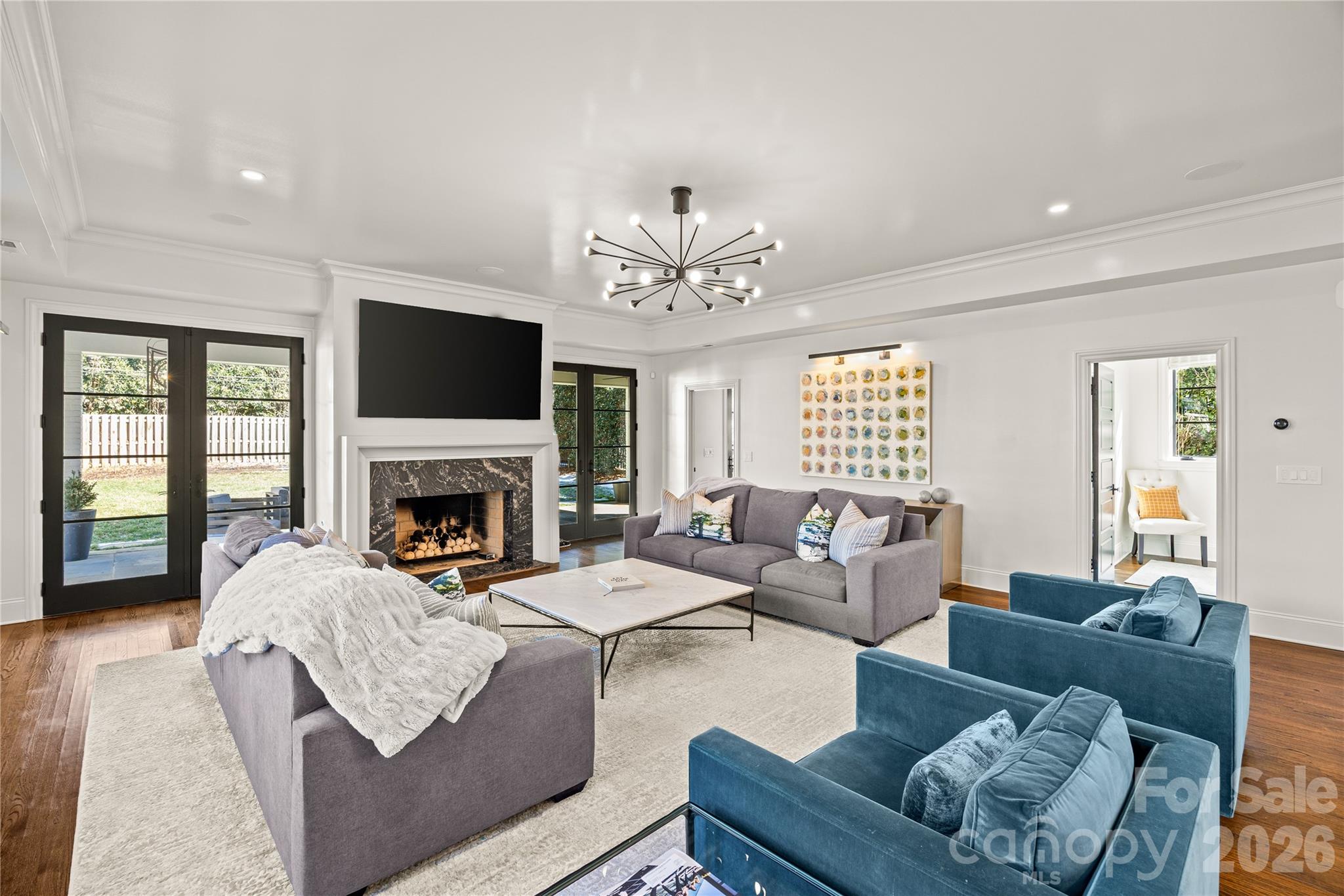 1935 Queens Road West Charlotte, NC 28207 - Photo 23 of 48 a living room with furniture a fireplace and a flat screen tv