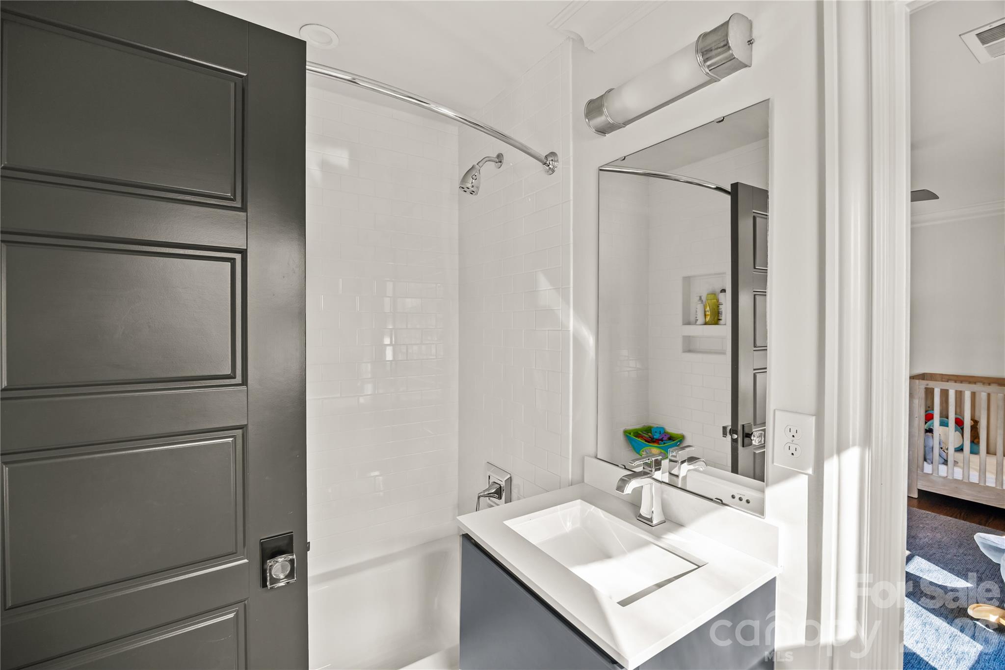 1935 Queens Road West Charlotte, NC 28207 - Photo 36 of 48 a bathroom with a sink vanity and a mirror
