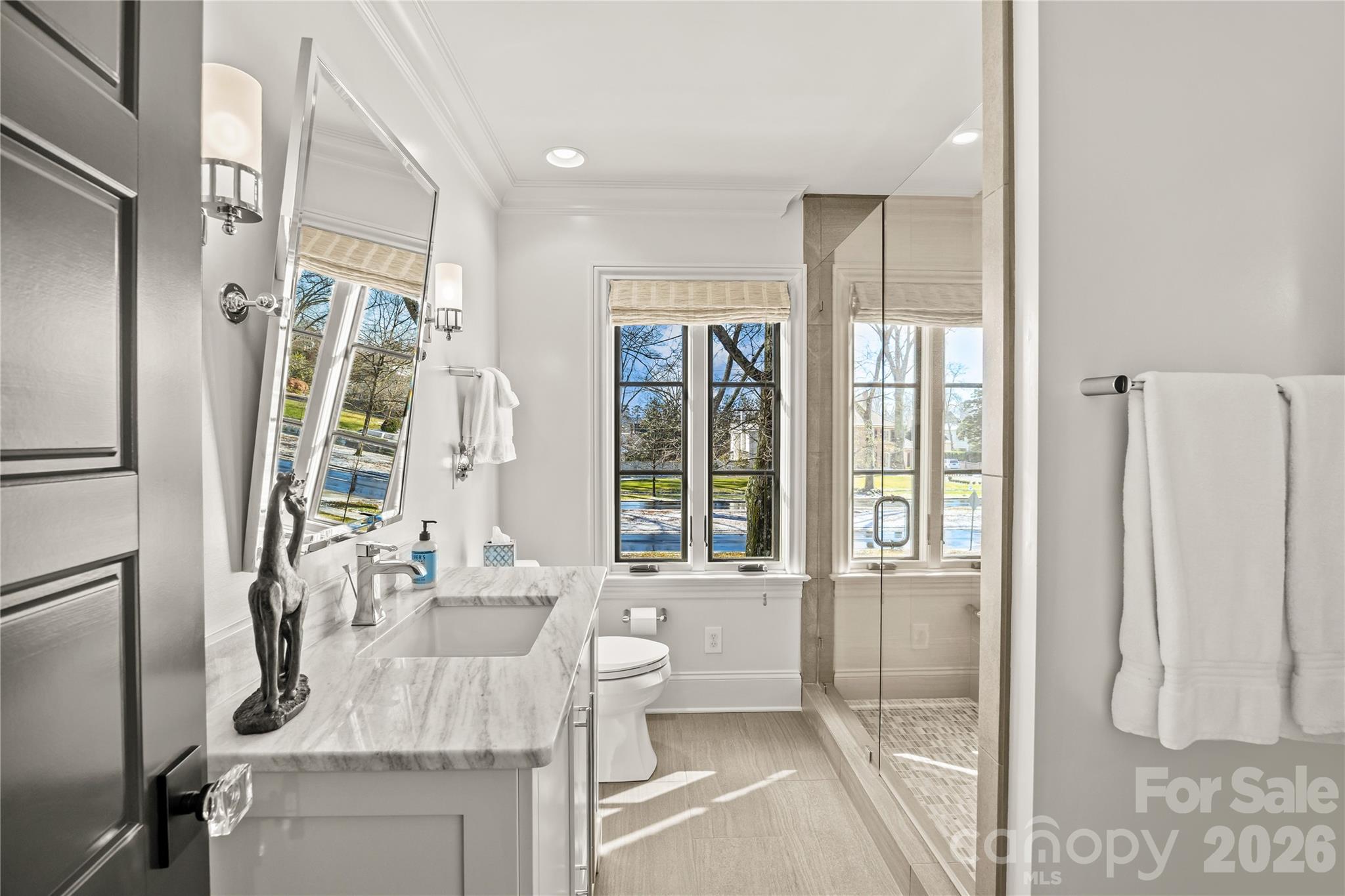 1935 Queens Road West Charlotte, NC 28207 - Photo 38 of 48 a bathroom with a tub sink and mirror
