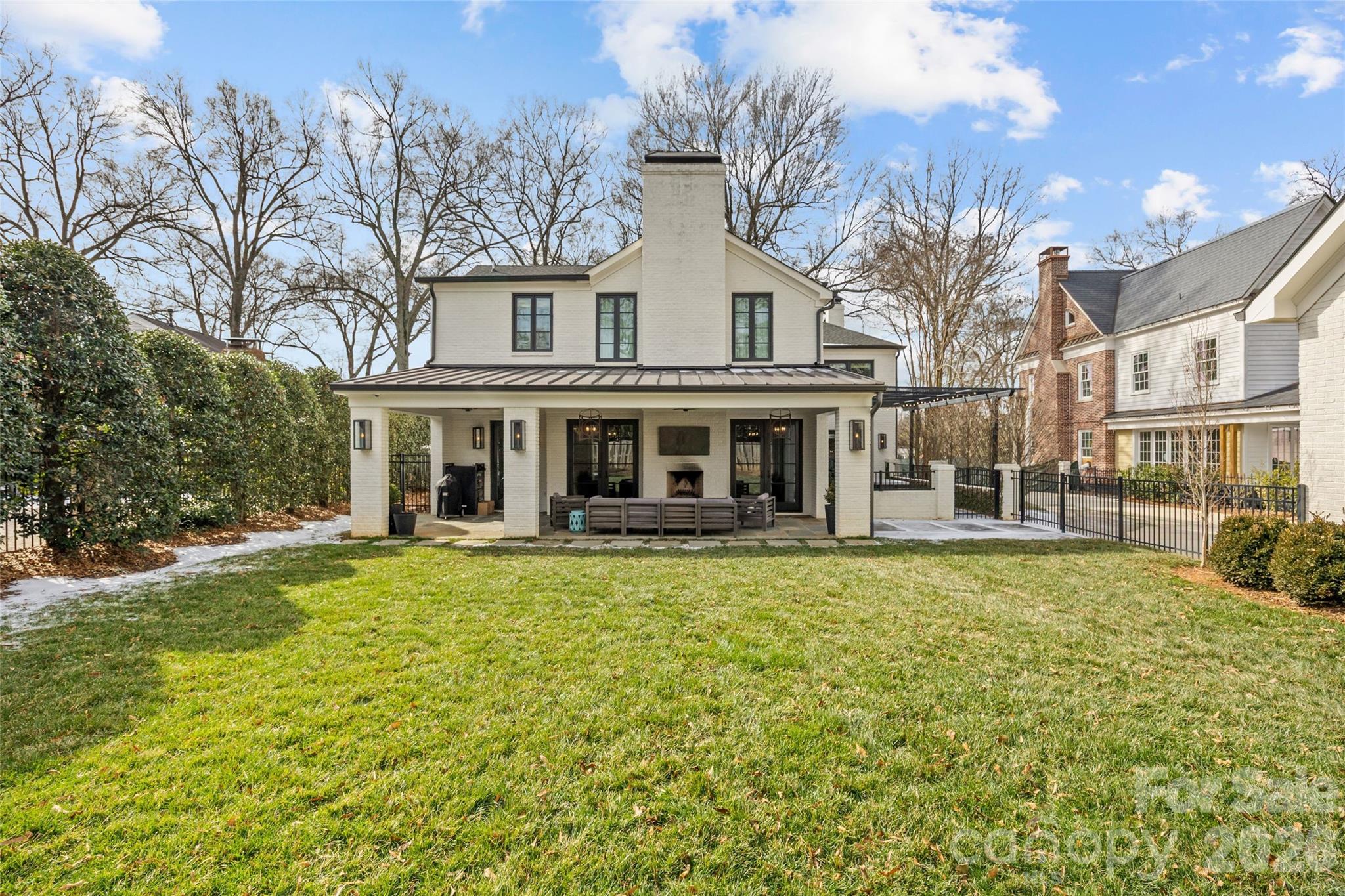 1935 Queens Road West Charlotte, NC 28207 - Photo 4 of 48 a front view of a house with a yard