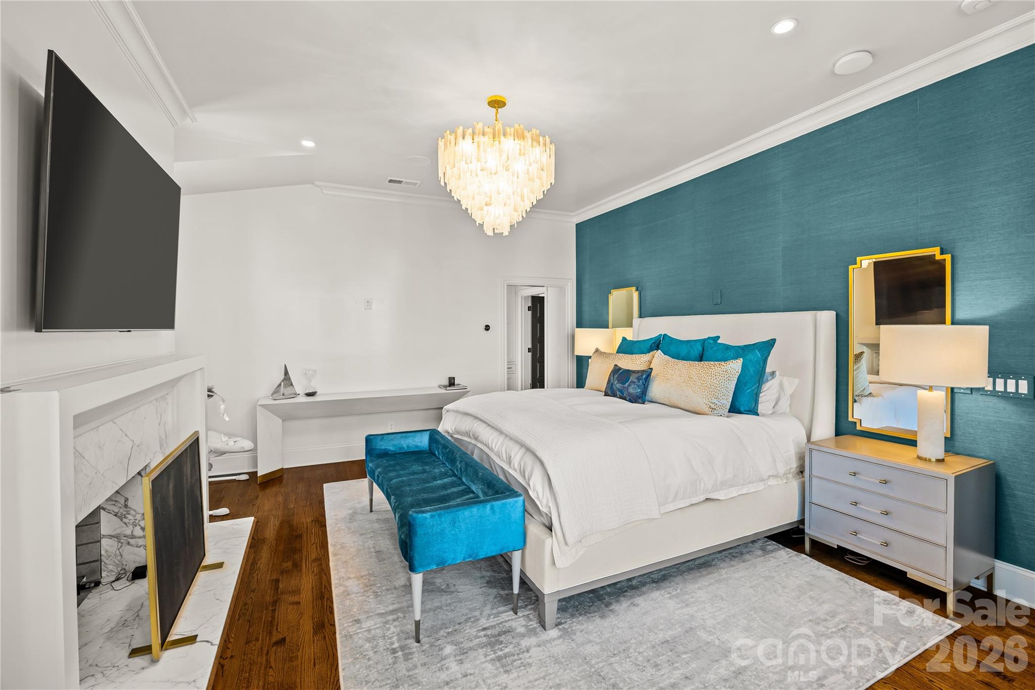 1935 Queens Road West Charlotte, NC 28207 - Photo 43 of 48 a bedroom with a bed and a chandelier