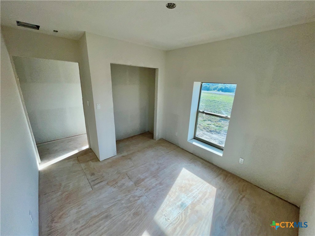 29 Carrie Street Port O'Connor, TX 77982 - Photo 23 of 29 a view of an empty room with window and closet area
