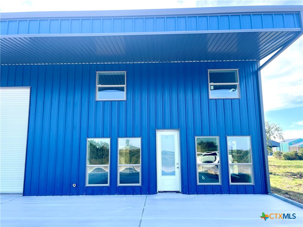 29 Carrie Street Port O'Connor, TX 77982 - Photo 4 of 29 a view of wooden door and outdoor seating