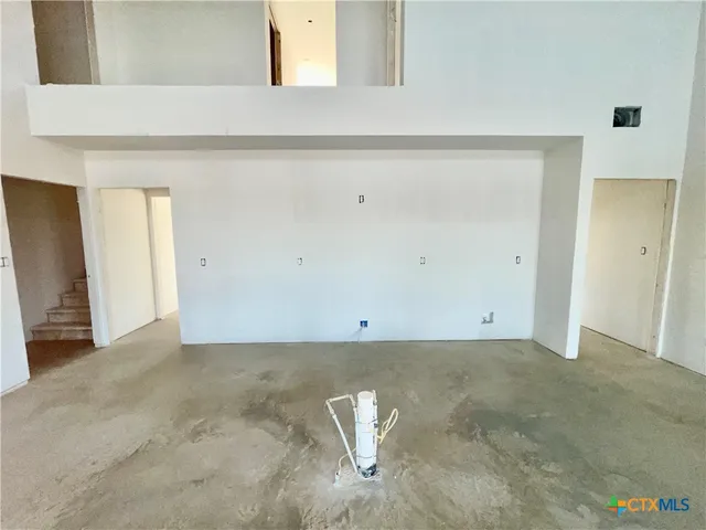 a view of room with window and hardwood floor