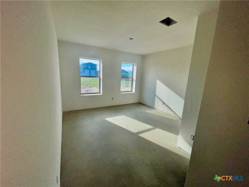 29 Carrie Street Port O'Connor, TX 77982 - Photo 10 of 29 a view of room with window and hardwood floor