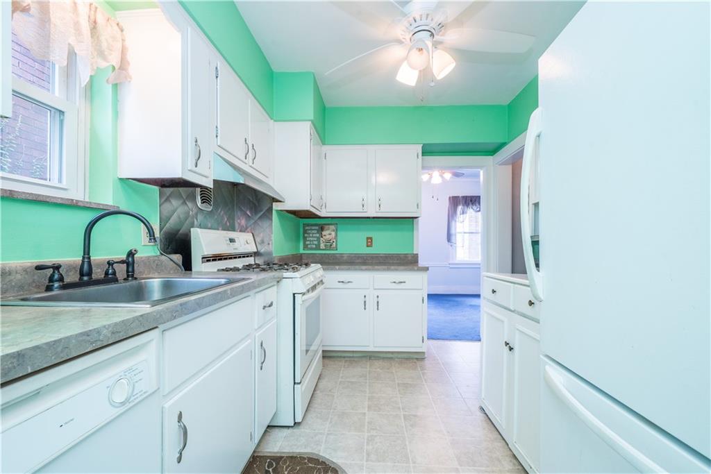 1819 Viruth Street Pittsburgh, PA 15212 - Photo 17 of 50 a kitchen with lots of counter space and a sink