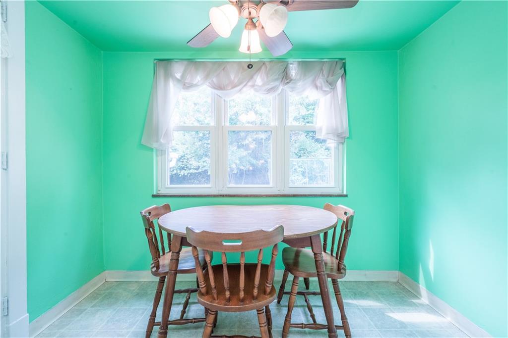 1819 Viruth Street Pittsburgh, PA 15212 - Photo 19 of 50 a view of a dining room with furniture a rug and a window