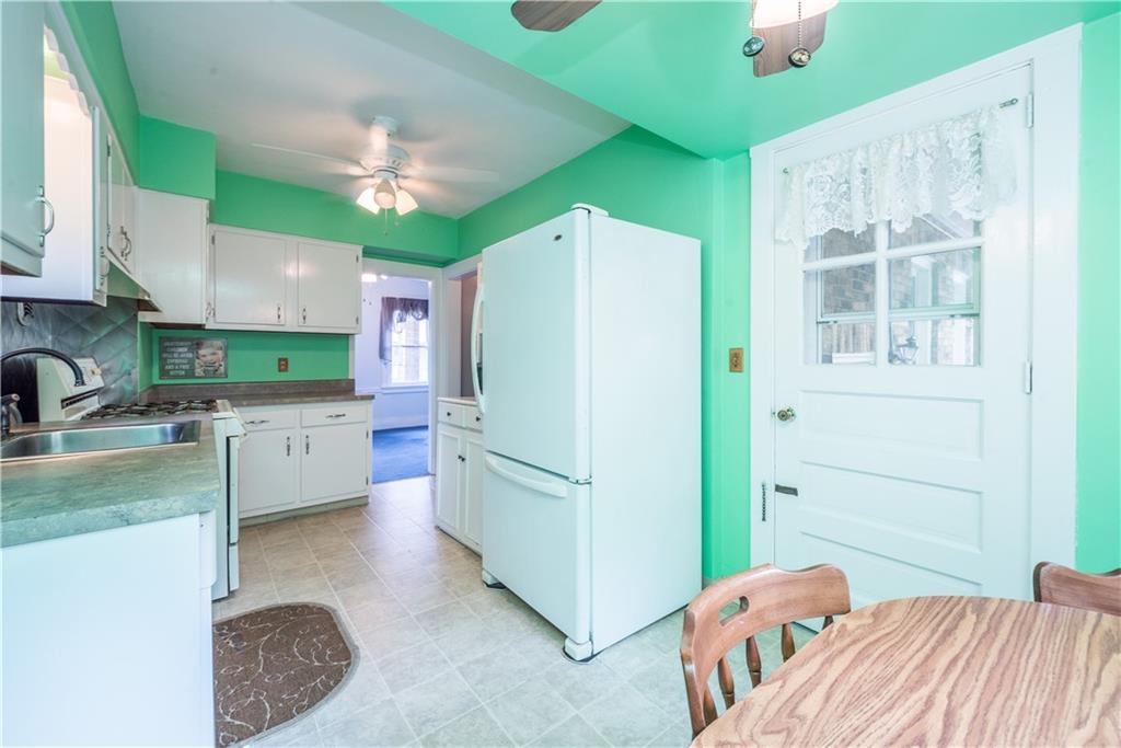 1819 Viruth Street Pittsburgh, PA 15212 - Photo 22 of 50 a kitchen with a refrigerator a sink and dishwasher