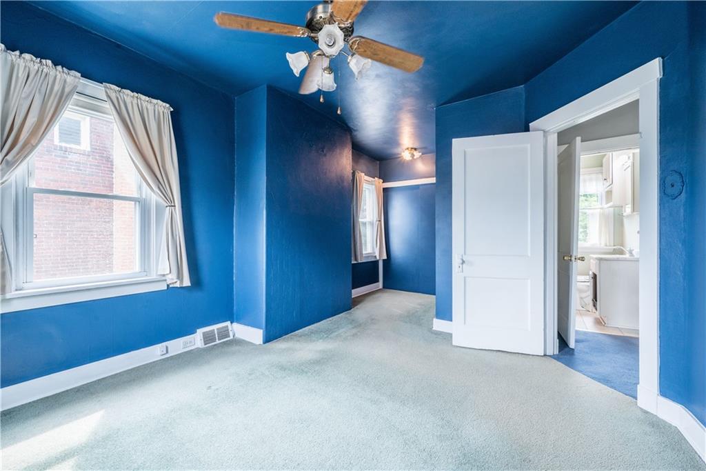 1819 Viruth Street Pittsburgh, PA 15212 - Photo 28 of 50 an empty room with chandelier fan and windows