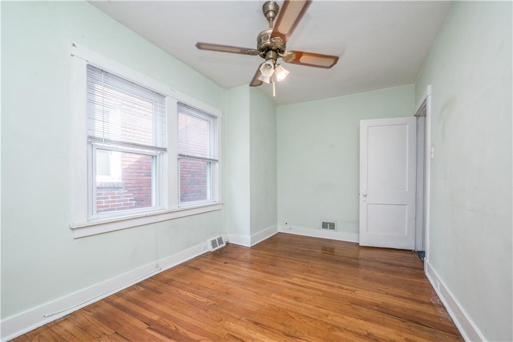 1819 Viruth Street Pittsburgh, PA 15212 - Photo 32 of 50 a view of empty room with wooden floor and fan