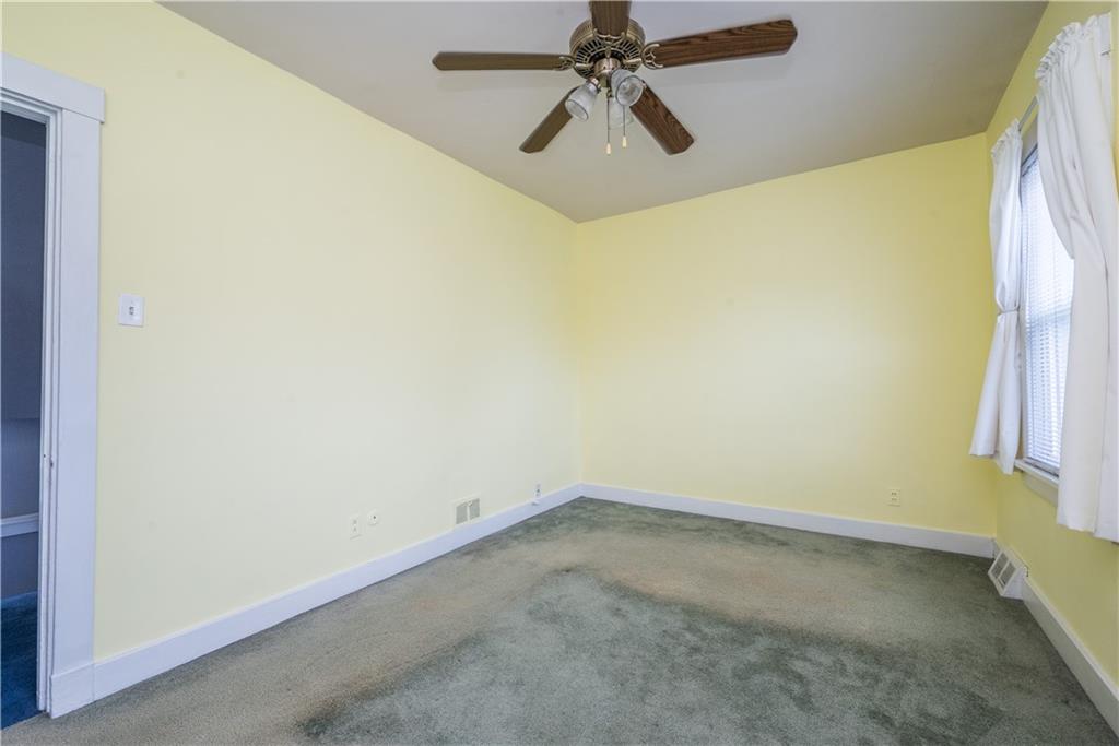 1819 Viruth Street Pittsburgh, PA 15212 - Photo 34 of 50 an empty room with a window and a fan