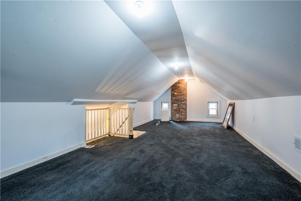 1819 Viruth Street Pittsburgh, PA 15212 - Photo 38 of 50 an empty room with wooden floor and windows