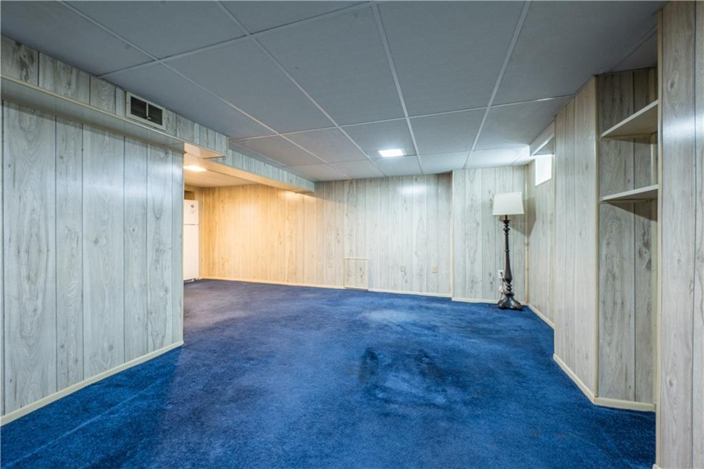 1819 Viruth Street Pittsburgh, PA 15212 - Photo 42 of 50 a view of an empty room with wooden floor and a window