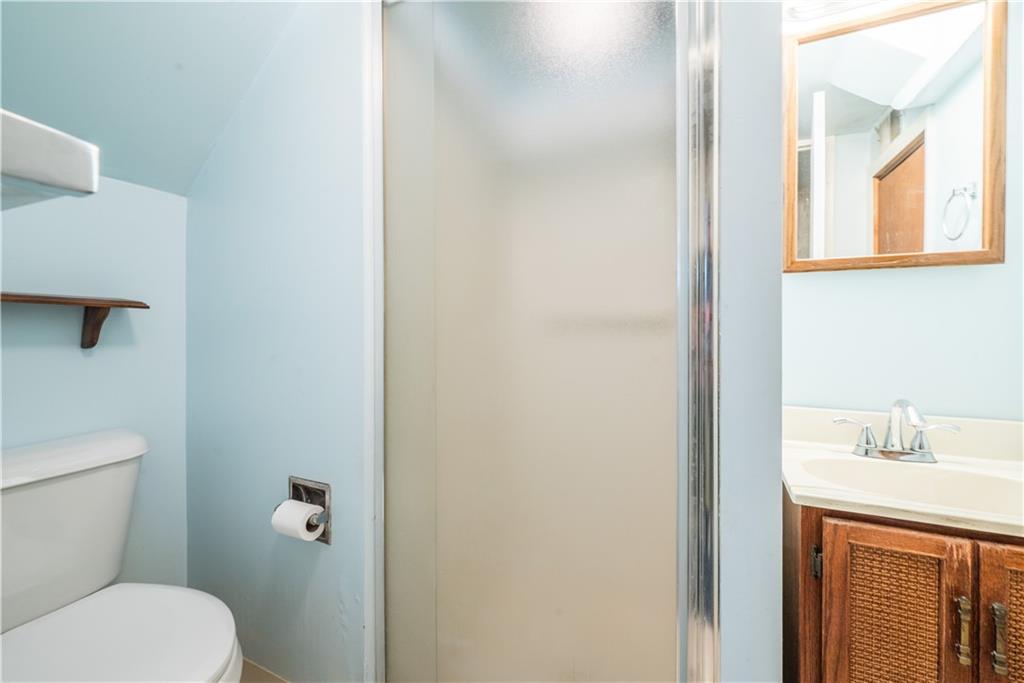 1819 Viruth Street Pittsburgh, PA 15212 - Photo 43 of 50 a bathroom with a toilet sink and mirror