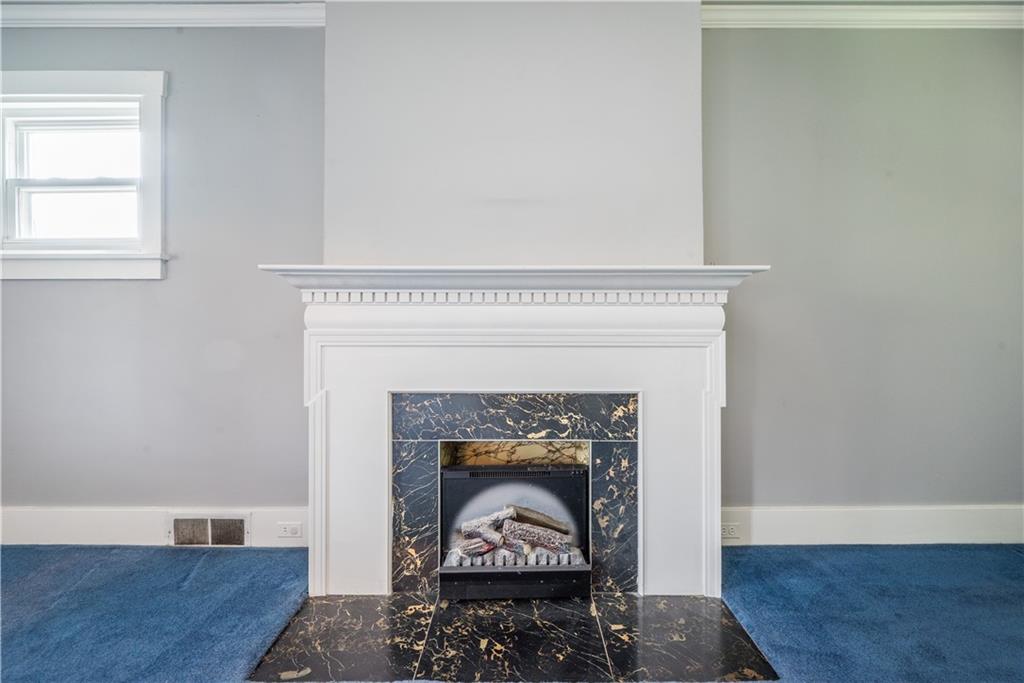 1819 Viruth Street Pittsburgh, PA 15212 - Photo 8 of 50 a living room with a fireplace