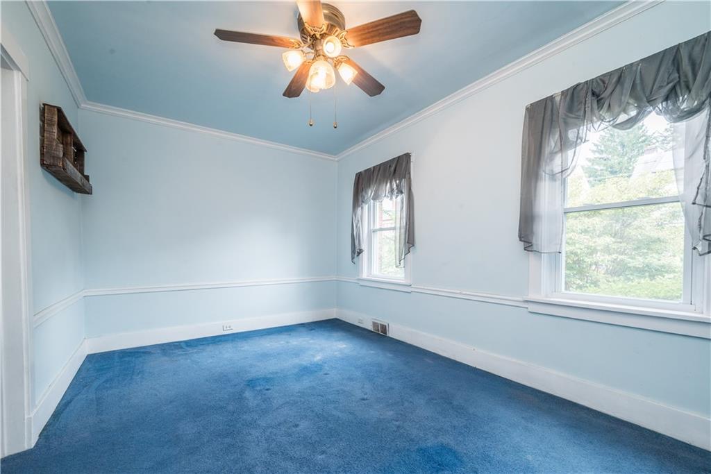 1819 Viruth Street Pittsburgh, PA 15212 - Photo 9 of 50 an empty room with windows and fan