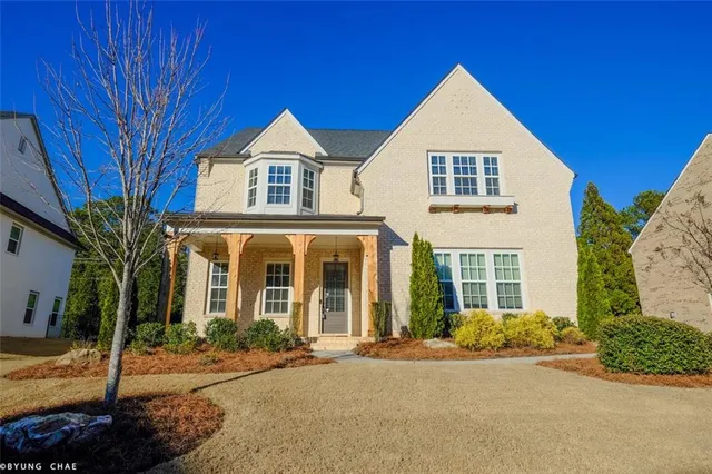 a front view of a house with a yard