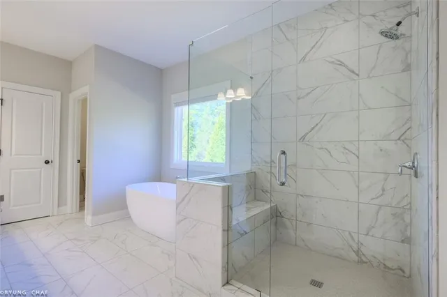a bathroom with a double vanity sink toilet and a mirror
