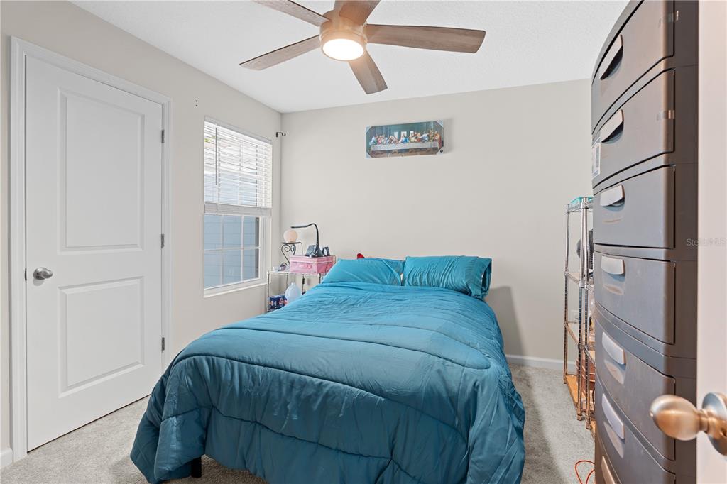 12003 Grizzly Lane New Port Richey, FL 34654 - Photo 33 of 43 a bedroom with a bed and a window