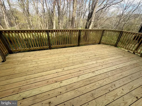 a view of balcony and wooden floor