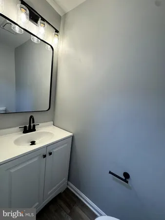 a bathroom with a sink and mirror