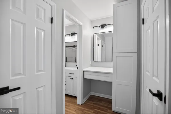 a bathroom with a double vanity sink and mirror