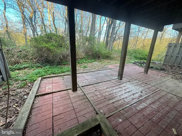 a view of a yard with wooden deck and floor