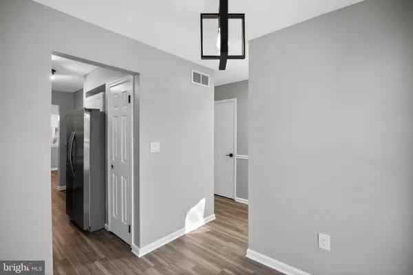 a view of hallway with wooden floor