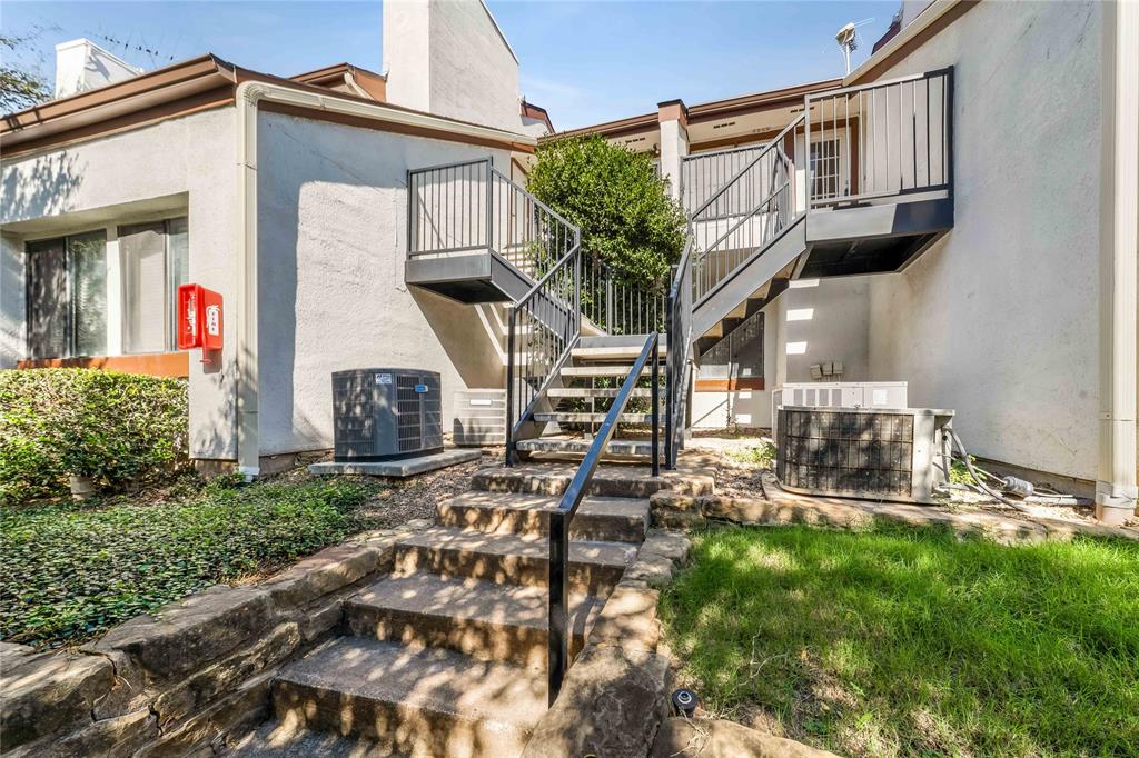 13217 Emily Road, Unit 3209 Dallas, TX 75240 - Photo 21 of 26 front view of house with a yard