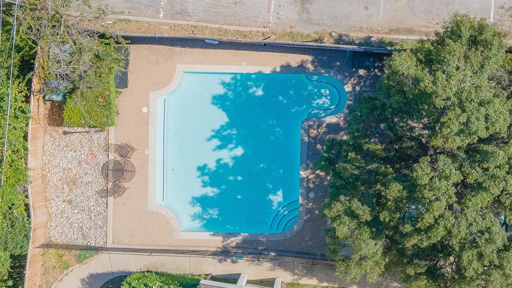 13217 Emily Road, Unit 3209 Dallas, TX 75240 - Photo 25 of 26 a view of a potted plants in front of door