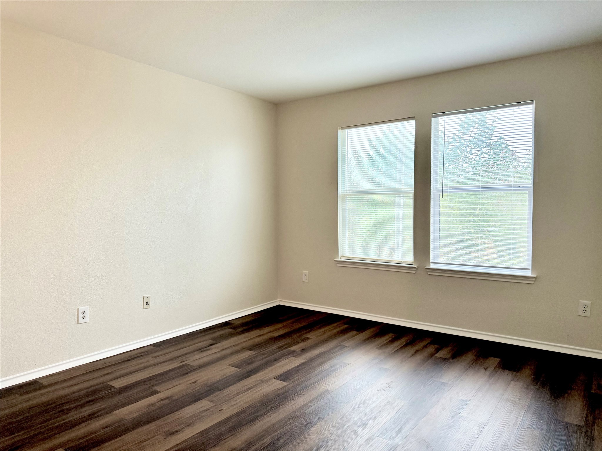 3814 Silver Bridge Lane Katy, TX 77449 - Photo 11 of 20 a view of an empty room with wooden floor and a window