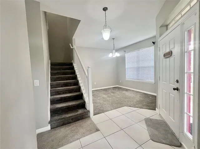 a view of an entryway with a chandelier