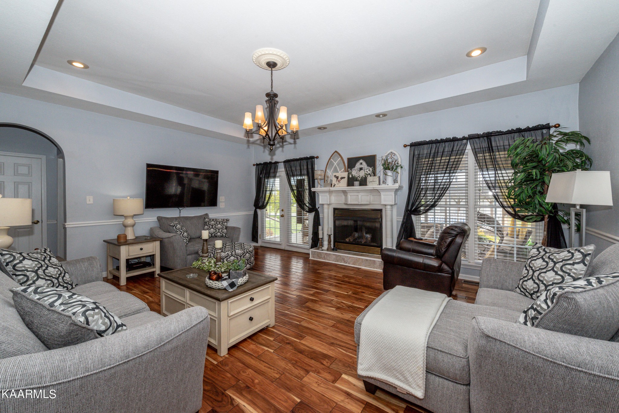 216 Gardner Road Philadelphia, TN 37846 - Photo 37 of 56 a living room with furniture a fireplace and a flat screen tv