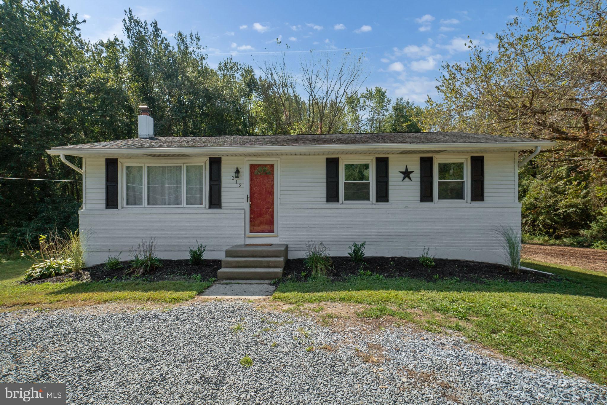 312 Fenwick Road Pilesgrove, NJ 08098 - Photo 1 of 40 a view of a house with a yard