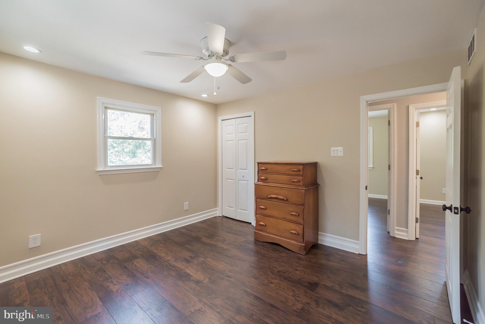 312 Fenwick Road Pilesgrove, NJ 08098 - Photo 11 of 40 an empty room with wooden floor closet and windows