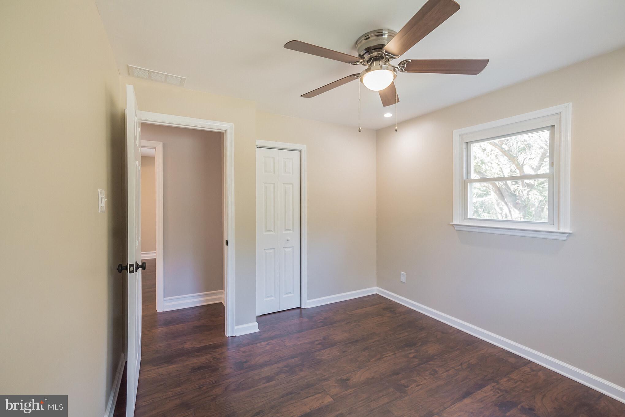 312 Fenwick Road Pilesgrove, NJ 08098 - Photo 13 of 40 wooden floor in an empty room with a window