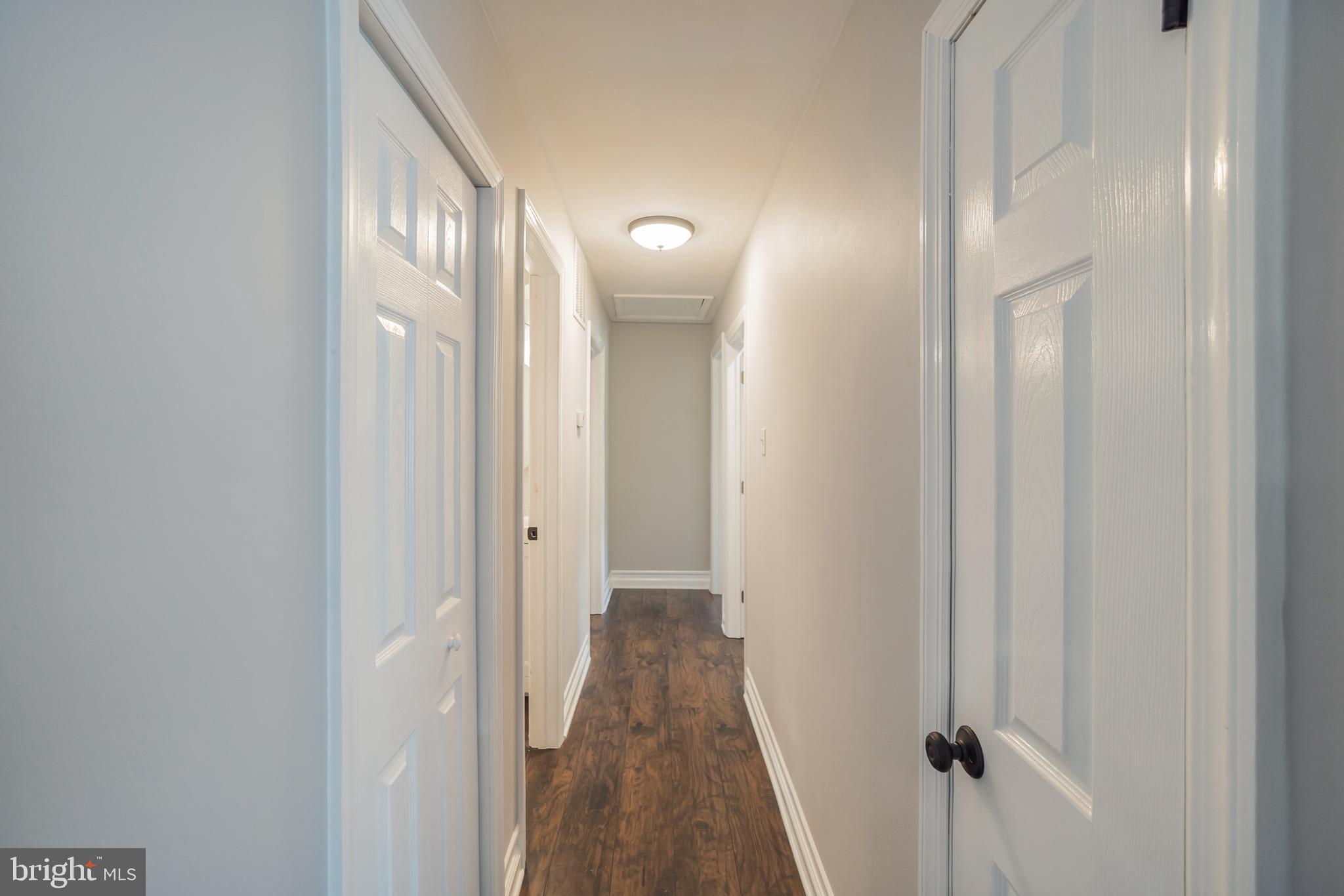 312 Fenwick Road Pilesgrove, NJ 08098 - Photo 21 of 40 a view of a hallway with wooden floor