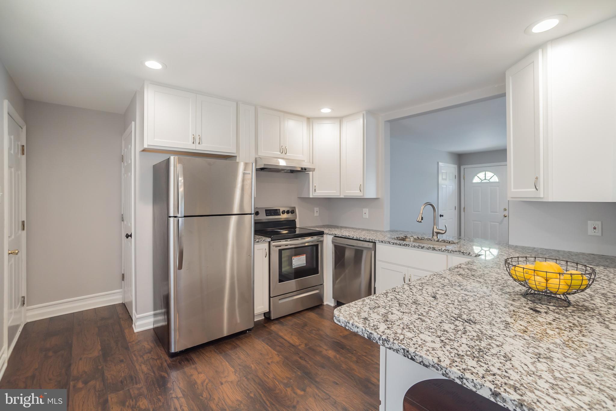 312 Fenwick Road Pilesgrove, NJ 08098 - Photo 23 of 40 a kitchen with a refrigerator sink and stove