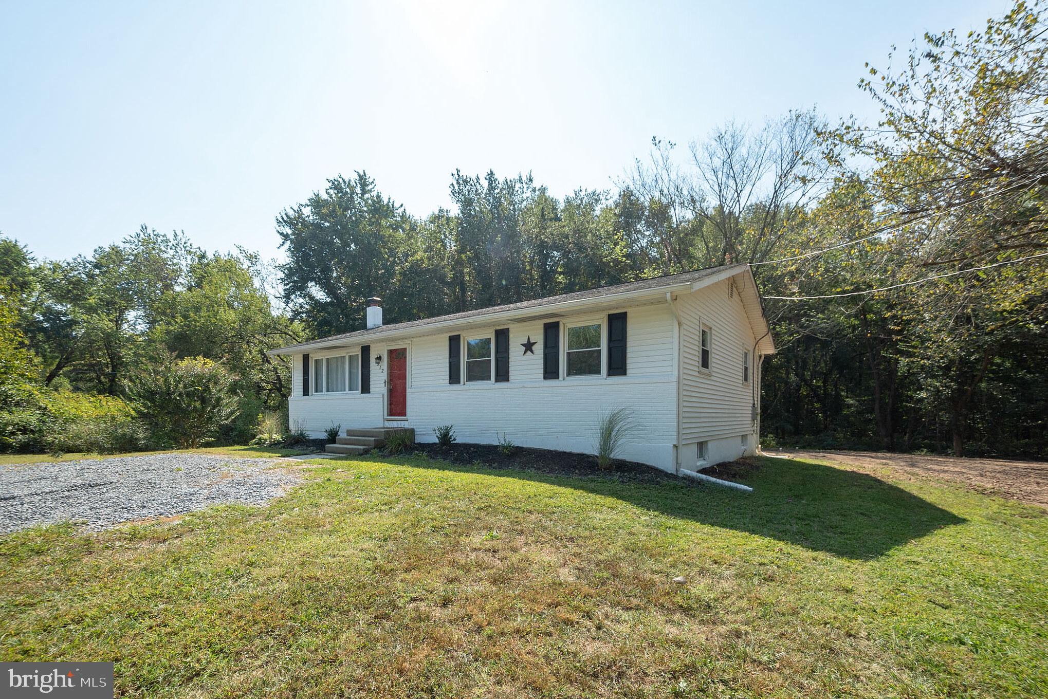 312 Fenwick Road Pilesgrove, NJ 08098 - Photo 30 of 40 a view of a house with a yard