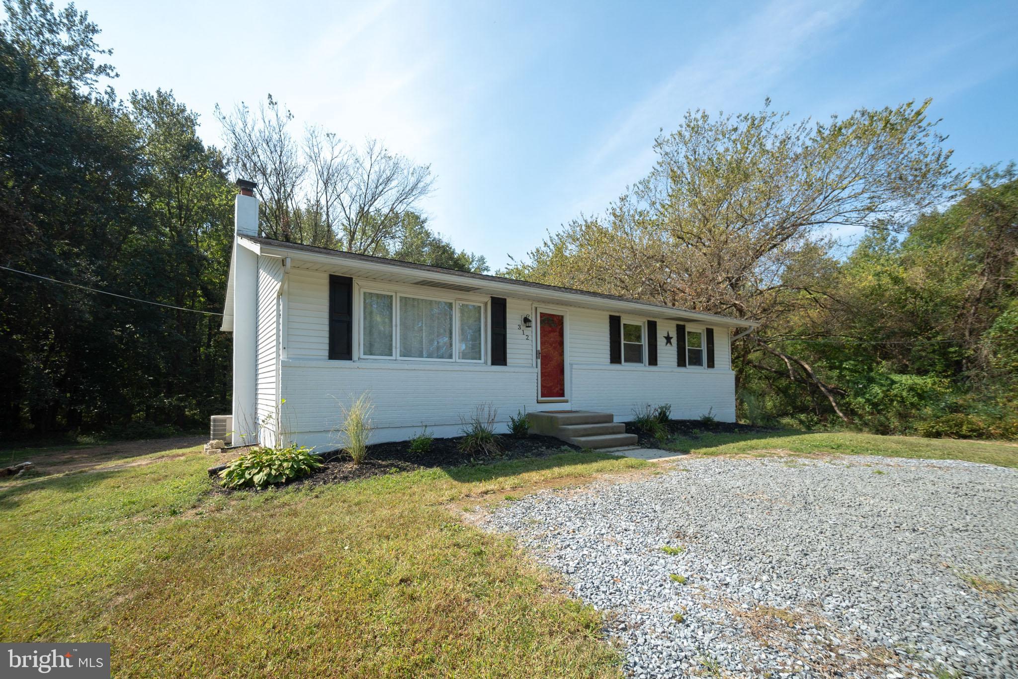 312 Fenwick Road Pilesgrove, NJ 08098 - Photo 31 of 40 a view of a house with a yard